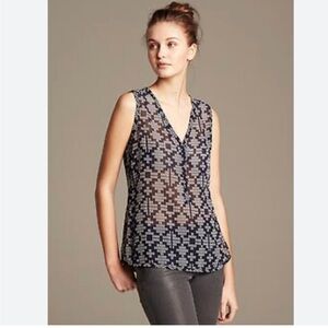 Sheer navy and white printed v-neck blouse with buttons